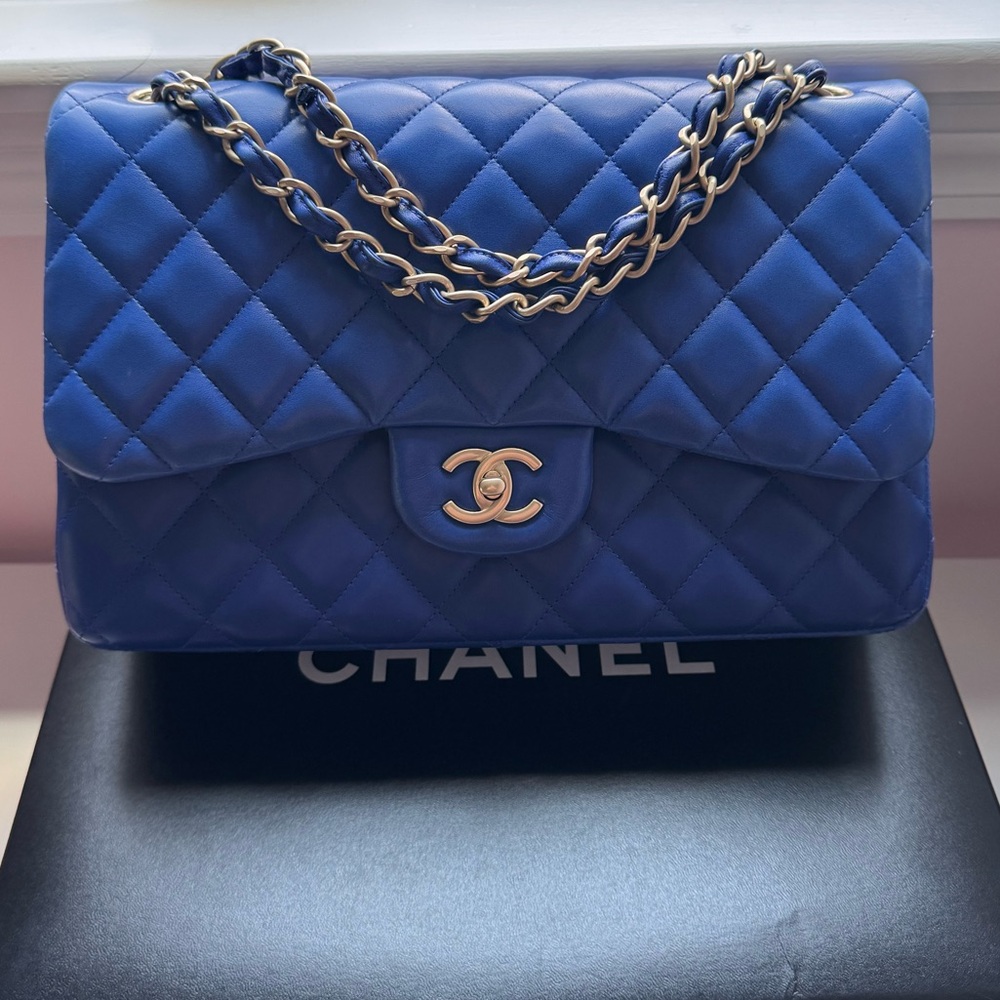 Authentic Chanel Jumbo Classic Lambskin flap bag in gorgeous cobalt blue color.